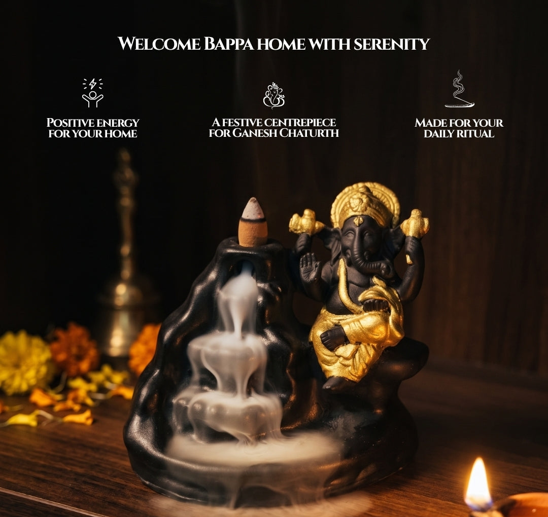 A black and gold Ganesha back flame incense burner sits on a wooden surface with smoke rising. The scene includes decorative flowers, a lit oil lamp, and promotional text at the top reading 'Welcome Bappa Home with Serenity' and three feature callouts.